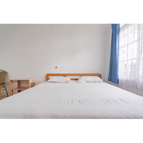 Pall Inn Puncak Mitra RedDoorz