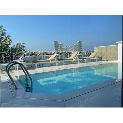 Palm Jumeirah Beachfront private pool villa 5 BR & 1 maids room with access to beach