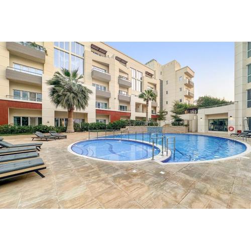 Pool View 1BR in Dubai Free Parking Gym Near Parks and Golf