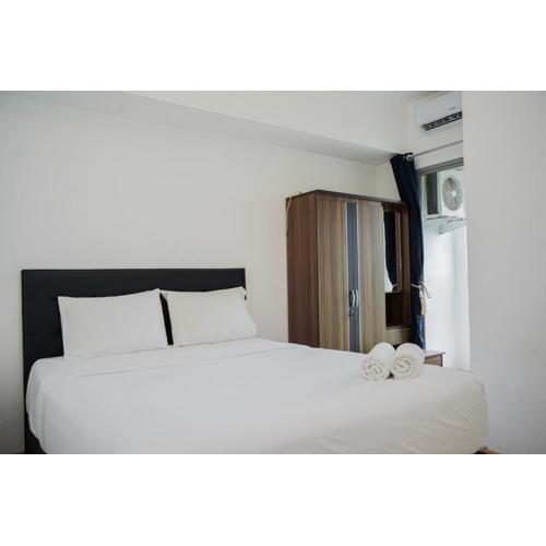 Restful and Cozy 2BR Apartment at M-Town Residence By Travelio