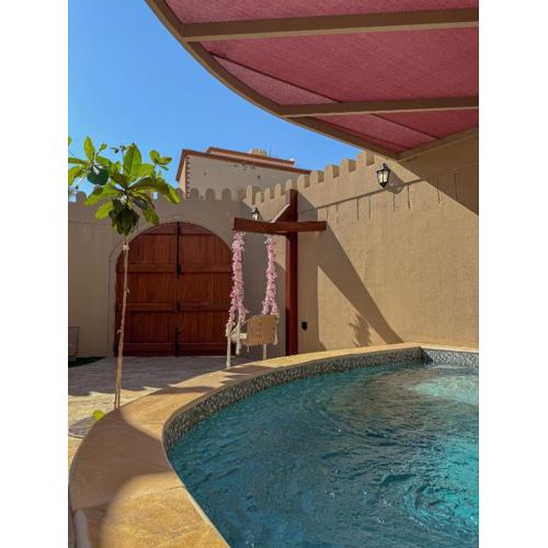 بيت أرض الثراء Rich Land House