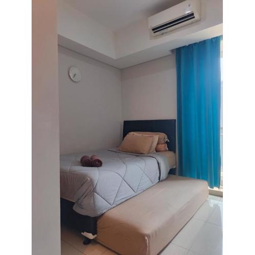 Room studio dengan twin bed