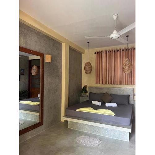 Sandbank Madiha deluxe bedroom with private bathroom