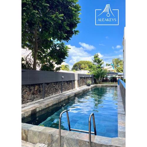 Sandy Feet Spacieux T4 Climatisé avec Piscine & Parking à Pereybere