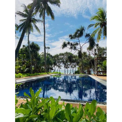 Sanjis The Seaside Cabanas