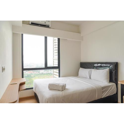Serene and Modern 2BR Sky House BSD Apartment near AEON By Travelio