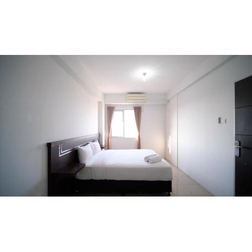 Simple 2BR with Extra Bed at Menara Rungkut Apartment By Travelio