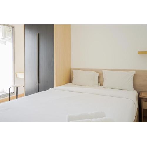 Simple and Cozy 2BR Apartment at M-Town Residence By Travelio