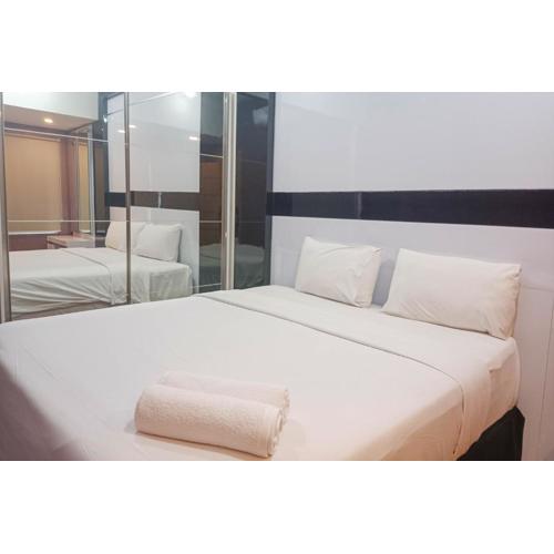 Simply 1BR at 31st Floor Vida View Makassar Apartment By Travelio