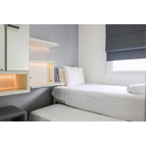 Simply 2BR Apartment at Parahyangan Residence By Travelio