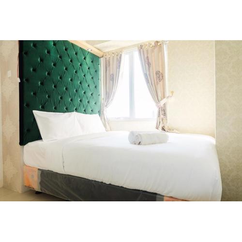 Simply 2BR with Pool View Bassura City Apartment By Travelio