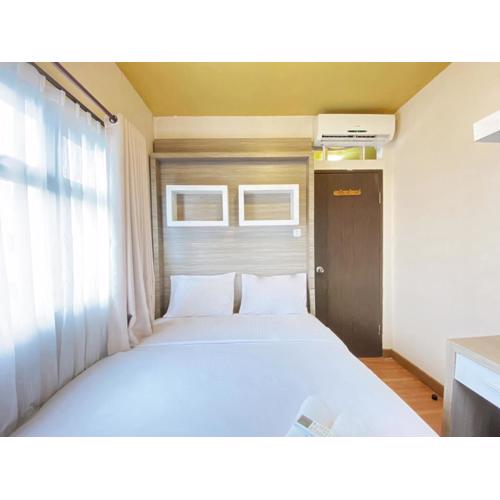 Simply Homey 2BR at Suites @Metro Apartment By Travelio