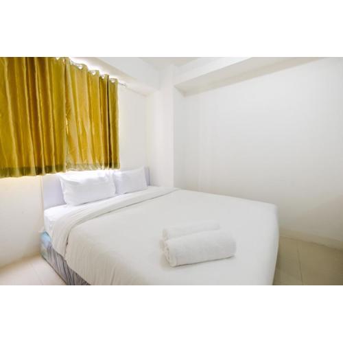 Simply Living 2BR at Bassura City Apartment By Travelio