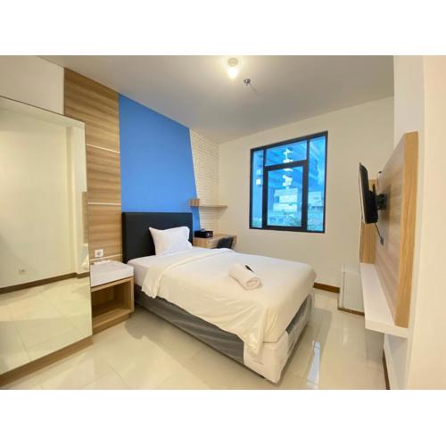 Simply Studio Room Semi Apartment at The Lodge Paskal near BINUS University By Travelio