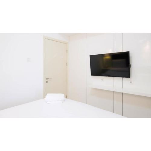 Spacey and Homey 2BR at Supermall Mansion Apartment By Travelio