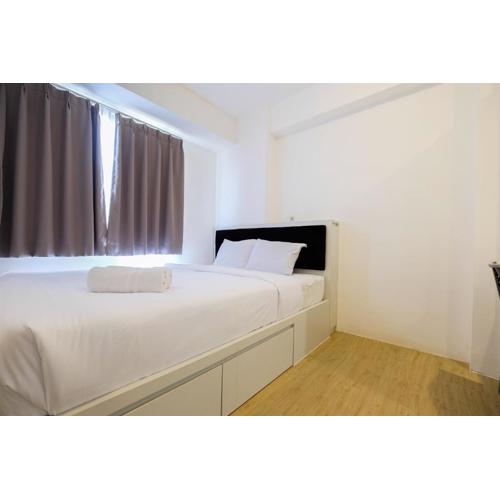 Spacious 2BR Apartment Connected to Mall at Bassura City By Travelio