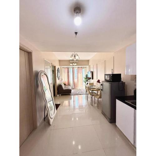 Spacious and Aesthetic 2 Bedroom with City-View Balcony at Grass Residences QC