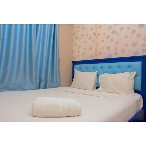 Spacious and Comfy 2BR Bassura City Apartment By Travelio