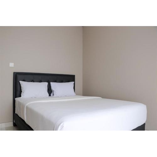 Spacious and Homey 2BR at Ciputra International Apartment By Travelio