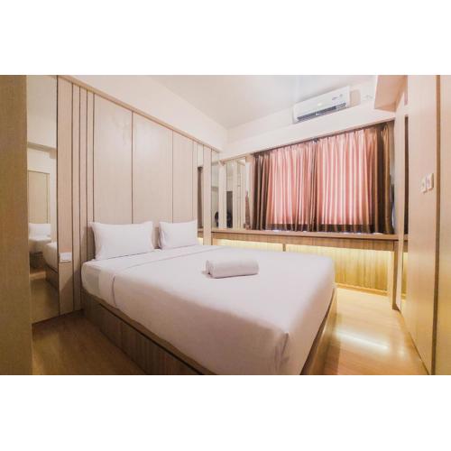 Spacious and Homey 2BR at Sky House BSD Apartment By Travelio