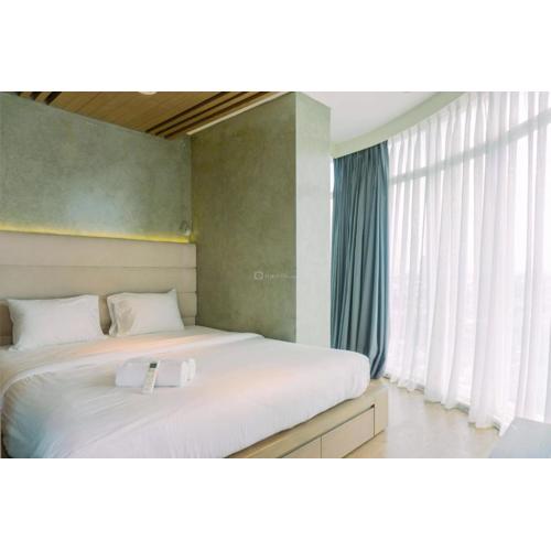 Spacious and Homey 2BR at Tree Park City Cikokol Apartment By Travelio