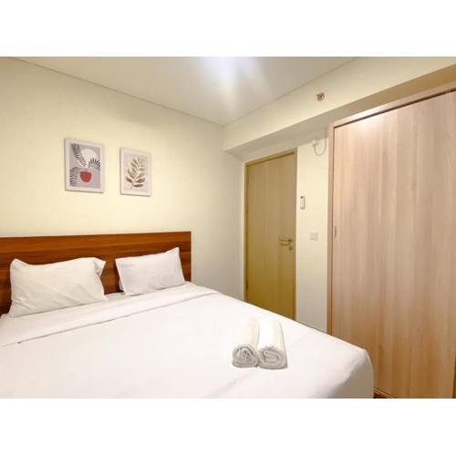 Spacious and Homey Apartment 2BR at Meikarta By Travelio