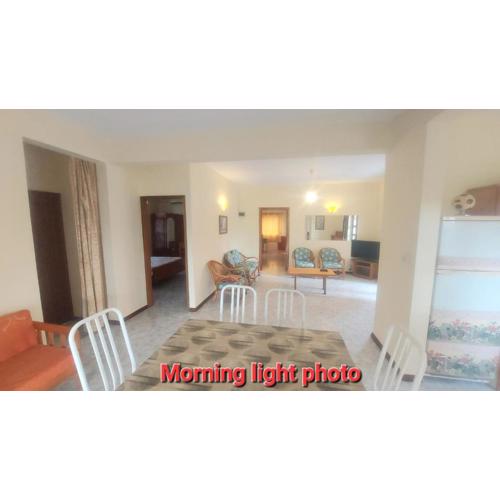 Spacious Groundfloor apartment 150m- public beach- AC both rooms