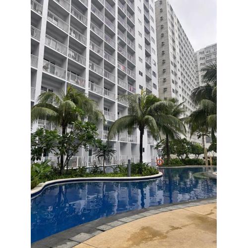 staycation condo one bedroom balcony w pool view near SMX SM MOA IKEA NAIA DFA OCEAN PARK