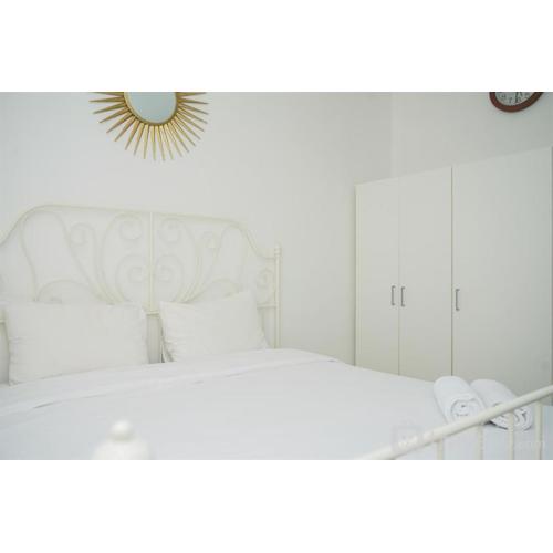 Strategic and Homey 2BR at Puri Garden Apartment near Mall By Travelio