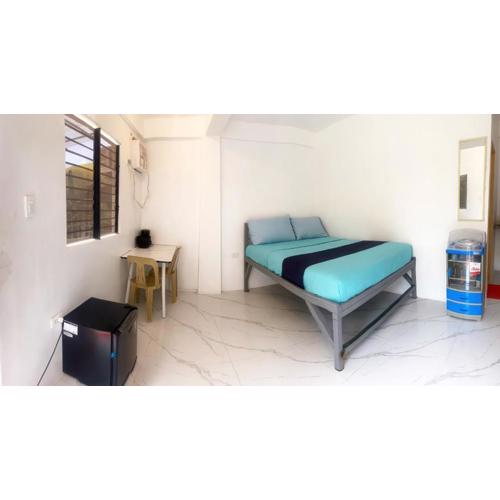Studio room with AC and kitchenette in the center