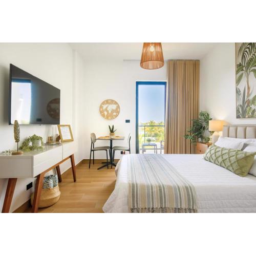 Stylish Downtown Punta Cana Studios - Balcony, Pool, and Gym Near Top Attractions