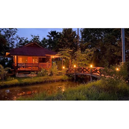Thai wooden house near the pond Mountain View Chiang mai
