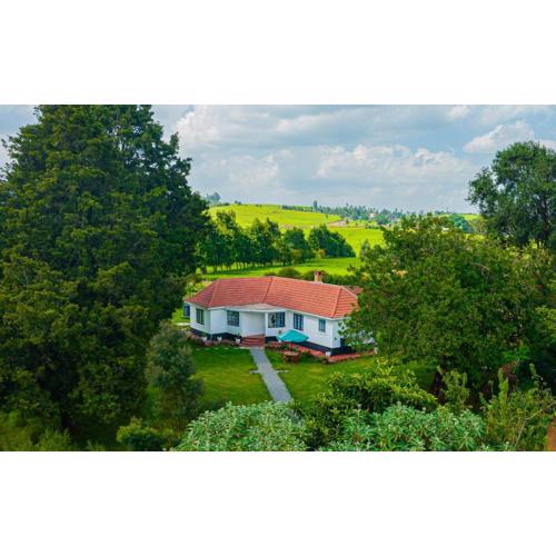 The Farmhouse, Tigoni, 1920s home, 85 acre tea farm, outdoor bath & shower