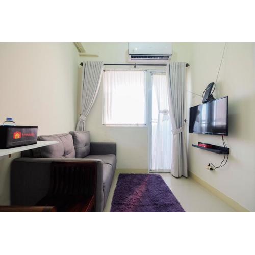 Tranquil 2BR @ Green Pramuka Apartment By Travelio