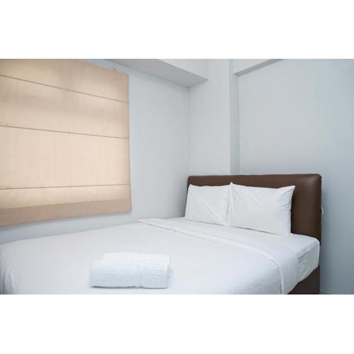 Tranquil Green Pramuka 2BR Apartment near Shopping Center By Travelio