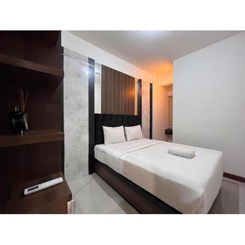 Warm and Cozy 2BR Vida View Makassar Apartment By Travelio