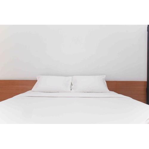 Warm and Cozy Studio Patraland Urbano Apartment By Travelio