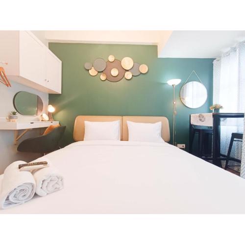 Warm and Homey Studio at Vida View Makassar Apartment By Travelio