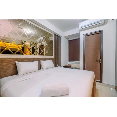 Warm and Minimalist Studio Room Transpark Cibubur Apartment By Travelio