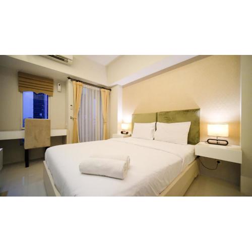 Warm Designed Studio at Orchard Supermall Mansion Apartment By Travelio