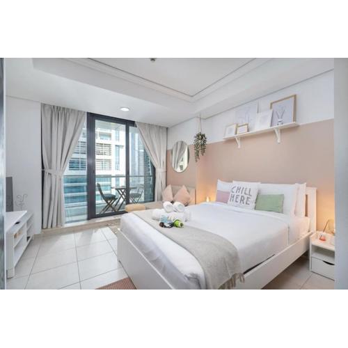 Waves - Cozy Studio with Balcony & Partial Lake Views