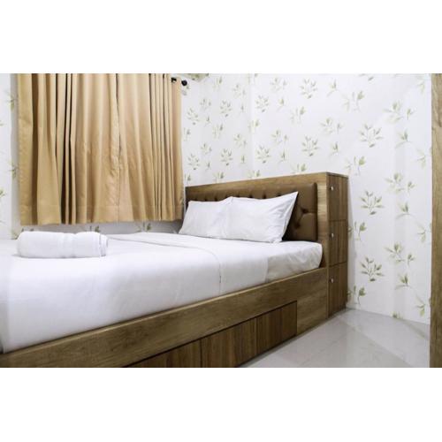 Well Designed 2BR Green Pramuka City Apartment By Travelio