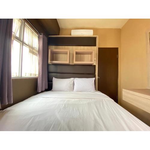 Well Furnished 2BR at Suites @Metro Apartment By Travelio